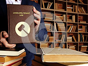 LANDLORD-TENANT LAW book in the hands of a attorney. Landlord-tenant lawÂ governs the rental of commercialÂ andÂ residential